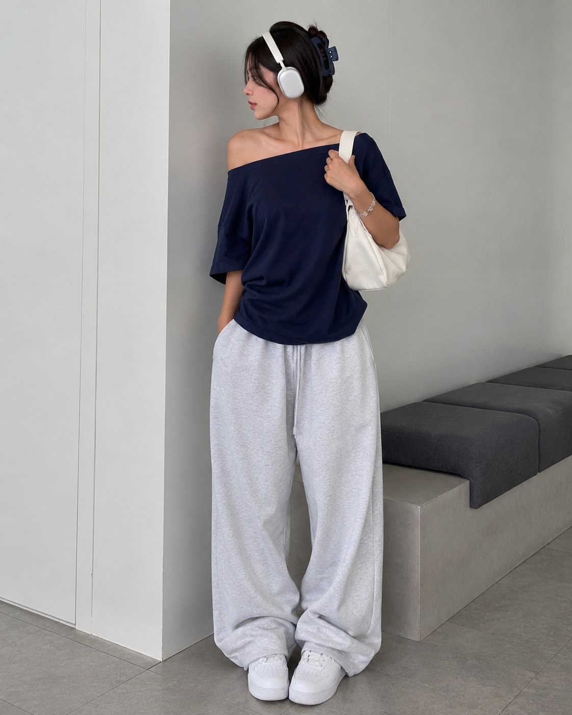 Off-shoulder navy tee with grey wide sweatpants, an athleisure-leaning clean girl outfit idea