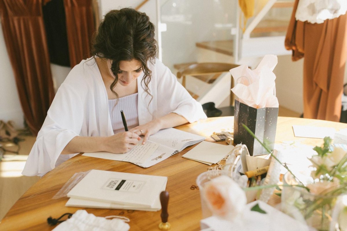 Person writing wedding speech notes