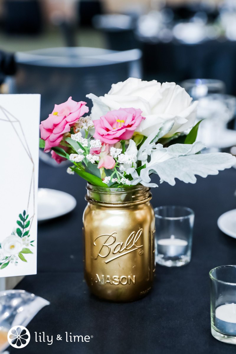 Gold mason jars wedding table setting