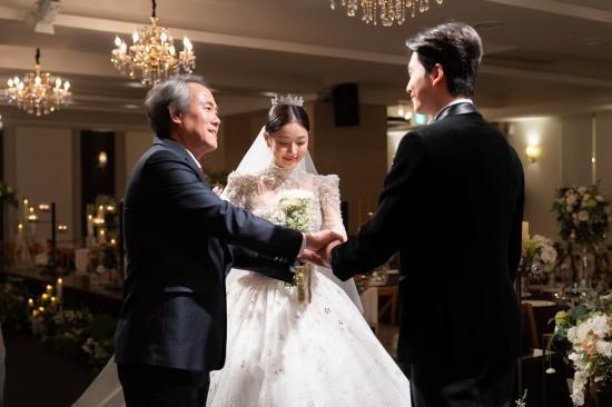 Father welcoming bride at wedding reception