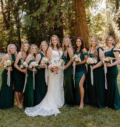 Forest green bridesmaid dresses with romantic styling