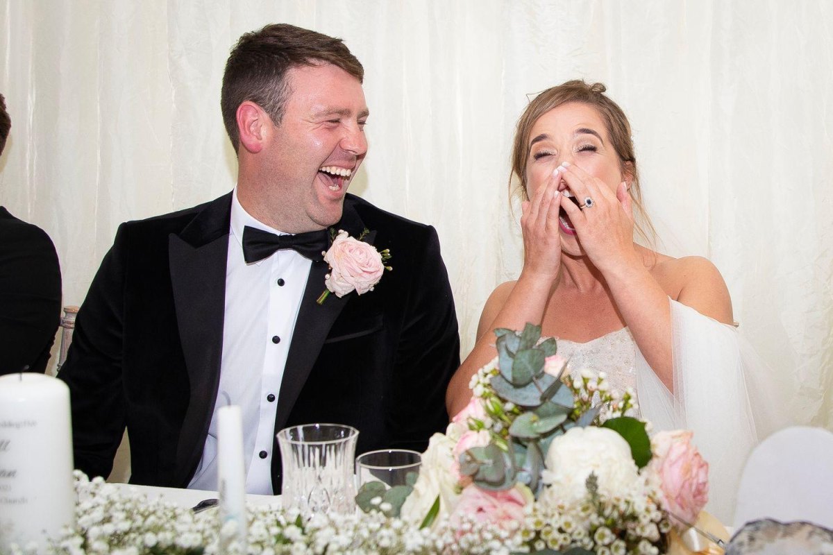 Newlywed couple laughing together