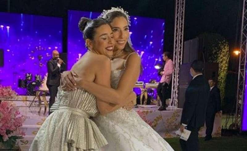 Sisters celebrating at wedding