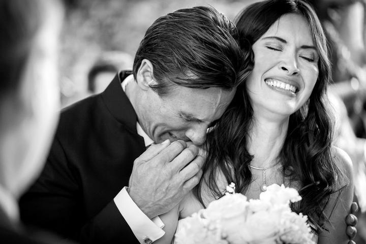 Wedding photographer discussing creative vision with wedding couple