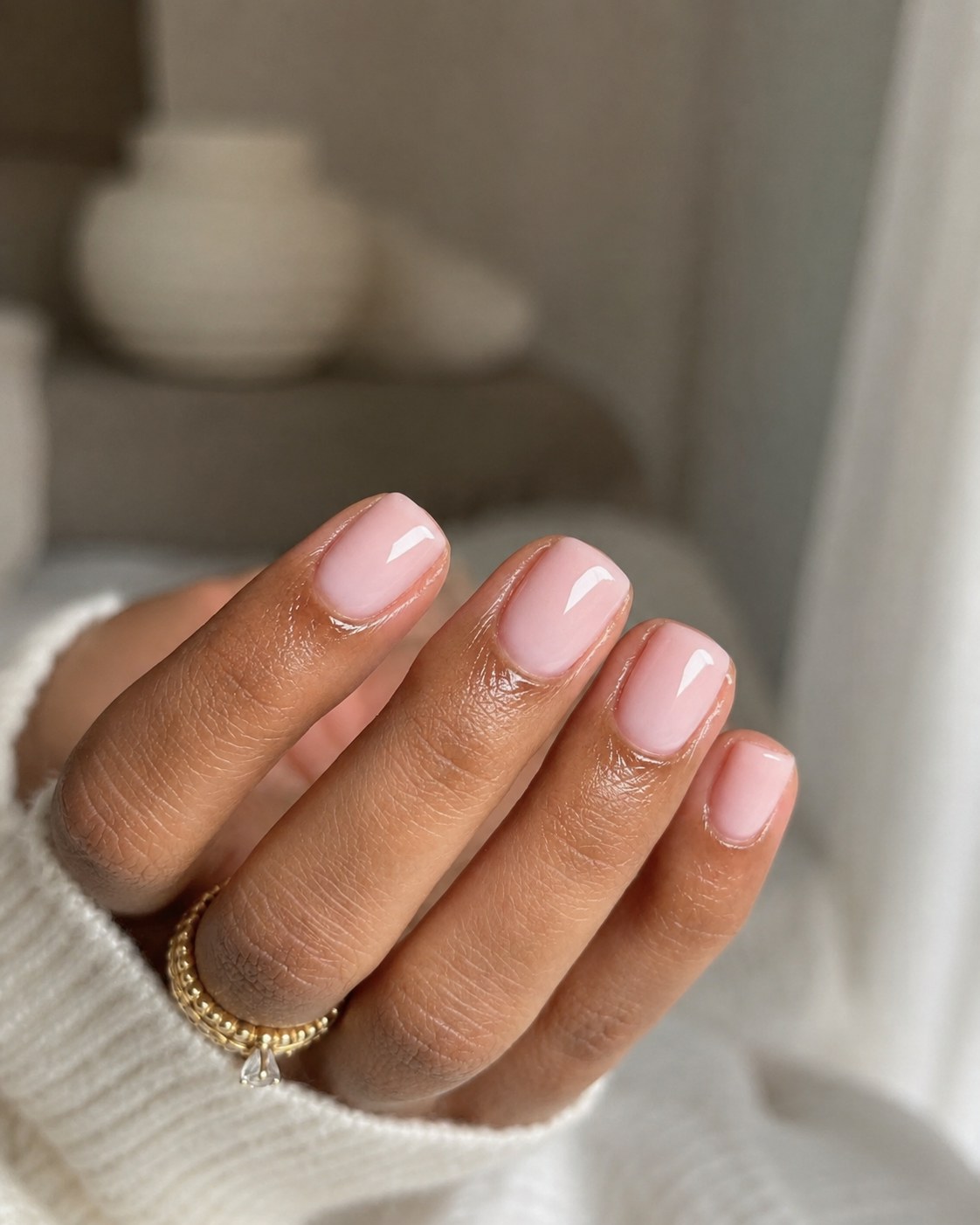Short glossy sheer pink short nails with a natural glass-milk finish