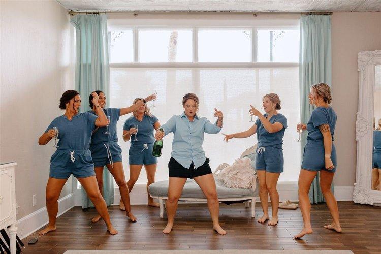 Bridesmaids dancing before wedding