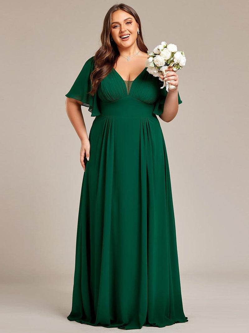 Plus size bridesmaids wearing elegant green dresses