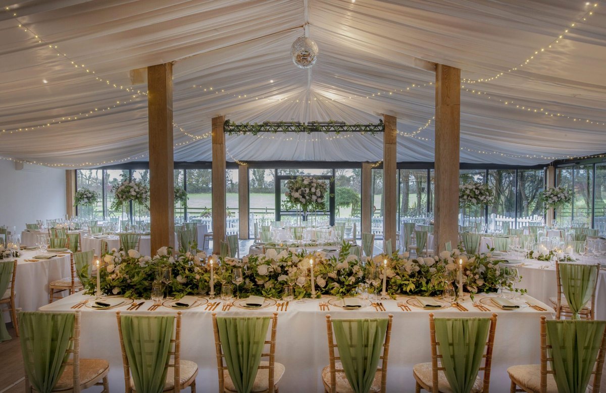 Sage green white wedding reception lighting