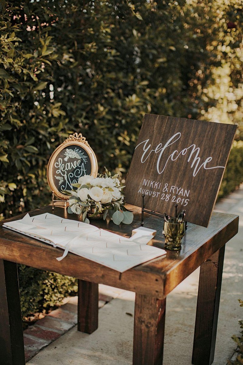 Custom backyard wedding guest book table