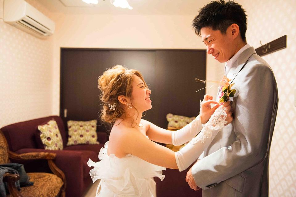 Wedding photographer discussing creative vision with wedding couple